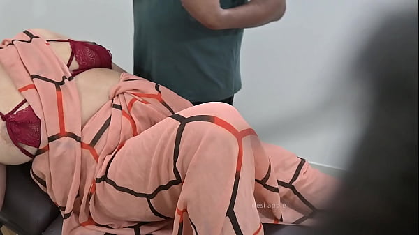 Indian doctor checking lady patient in clinic