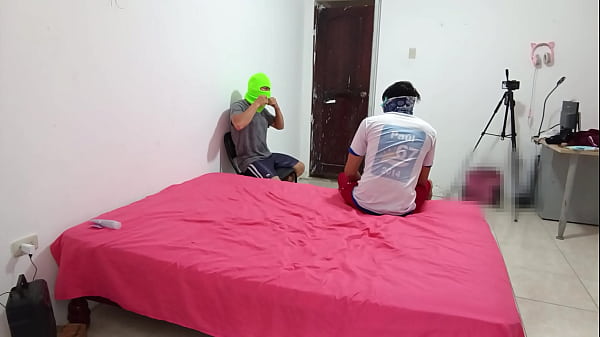The Indian woman flirts with two men while filming her porn scene and fucks with a skin-colored dildo.